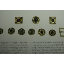 Gold button, geometrically derived cross, solar symbol